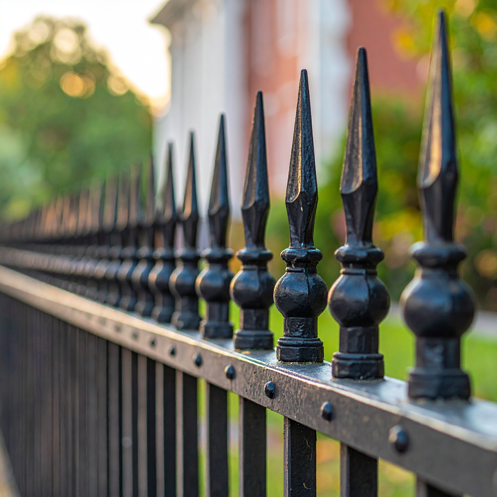 Close-up view of a sturdy wrought iron fence with pointed finials strong vertical li 612200 - San Antonio Deck and Fence Works Black wrought iron fence with finials-deck builder-San Antonio, Texas