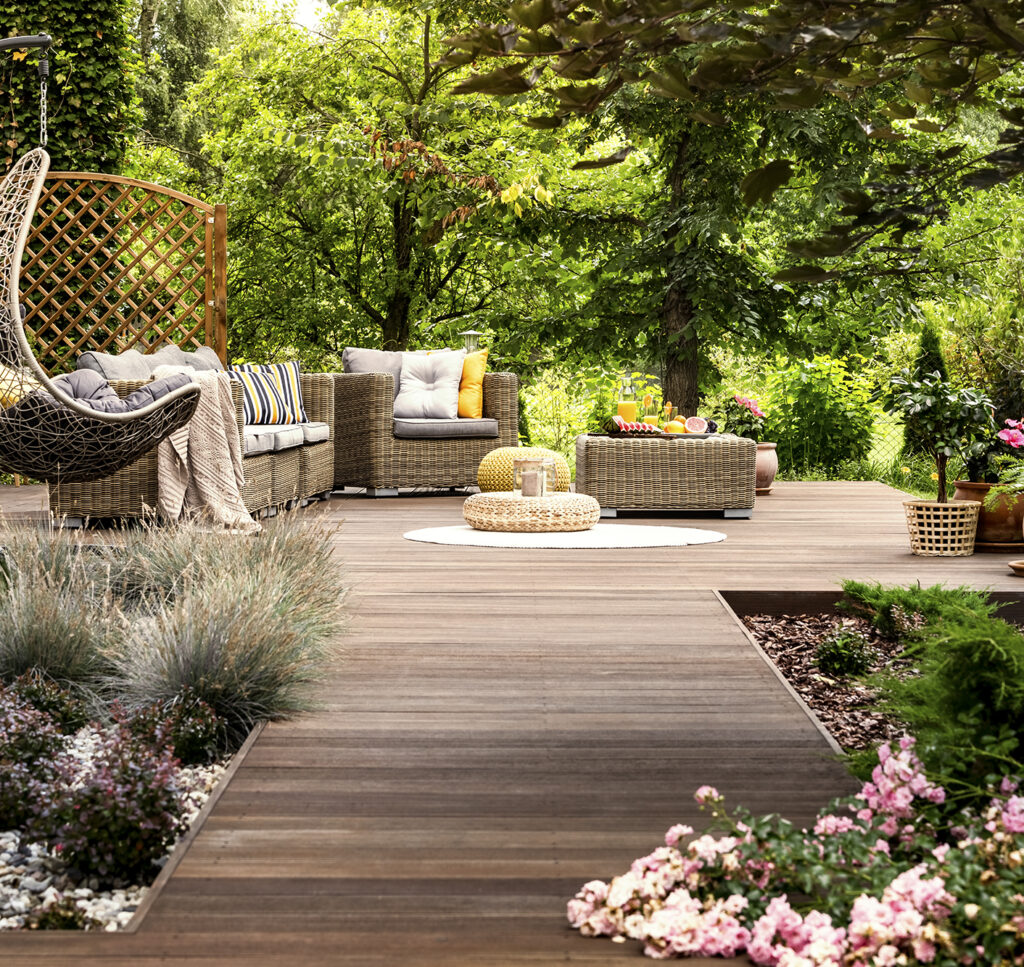 Wooden terrace surrounded by greenery - San Antonio Deck and Fence Works custom deck designs in San Antonio Texas