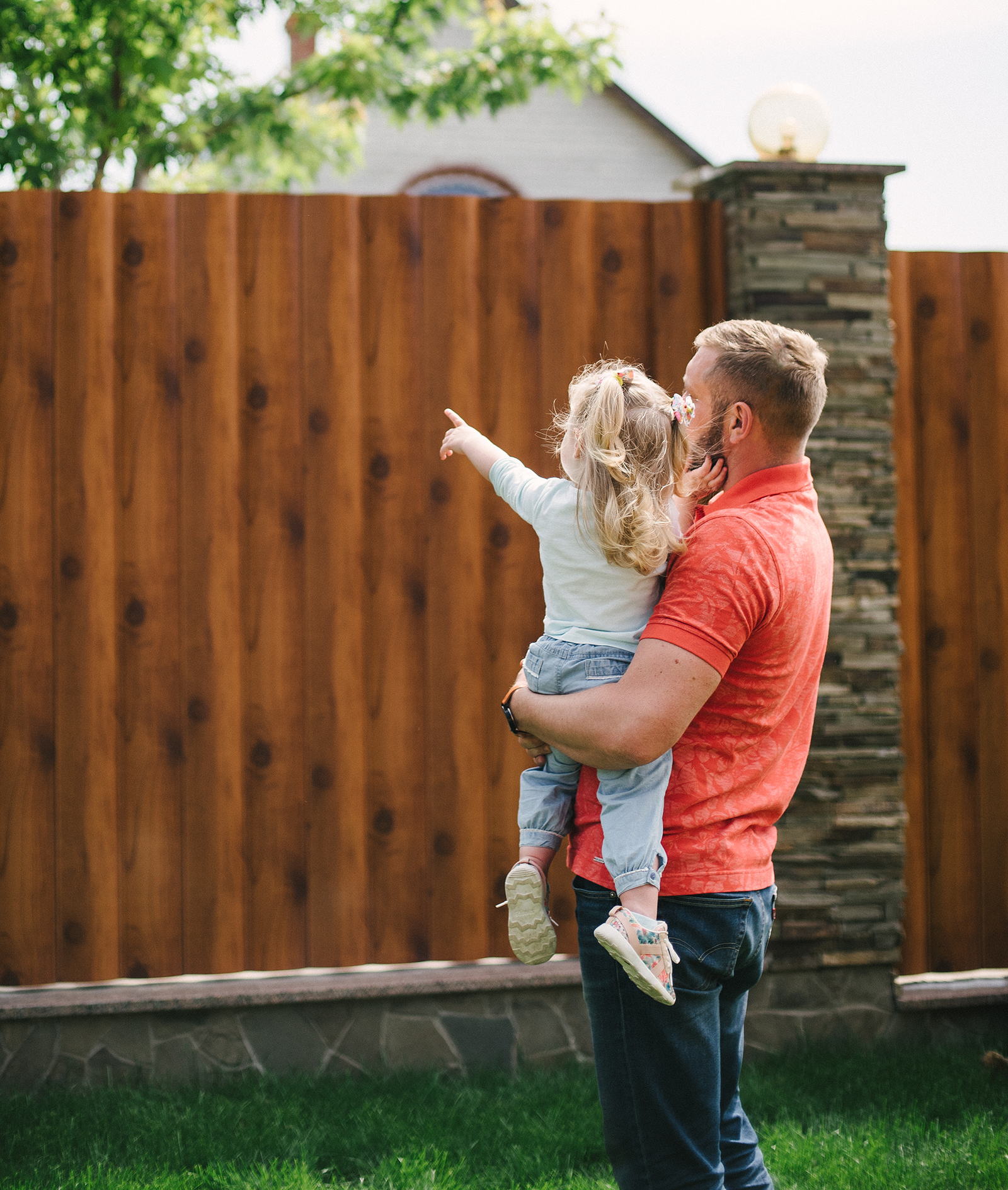 Happy family enjoying a new fence - San Antonio, Texas